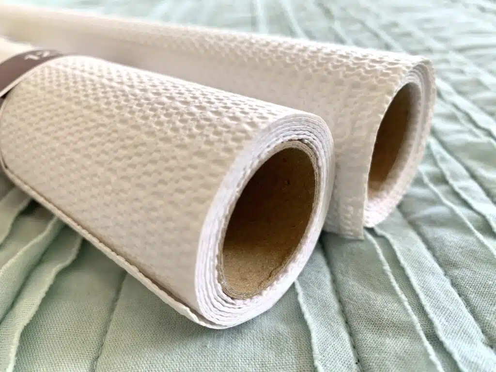 two rolls of white no-slip drawer liner