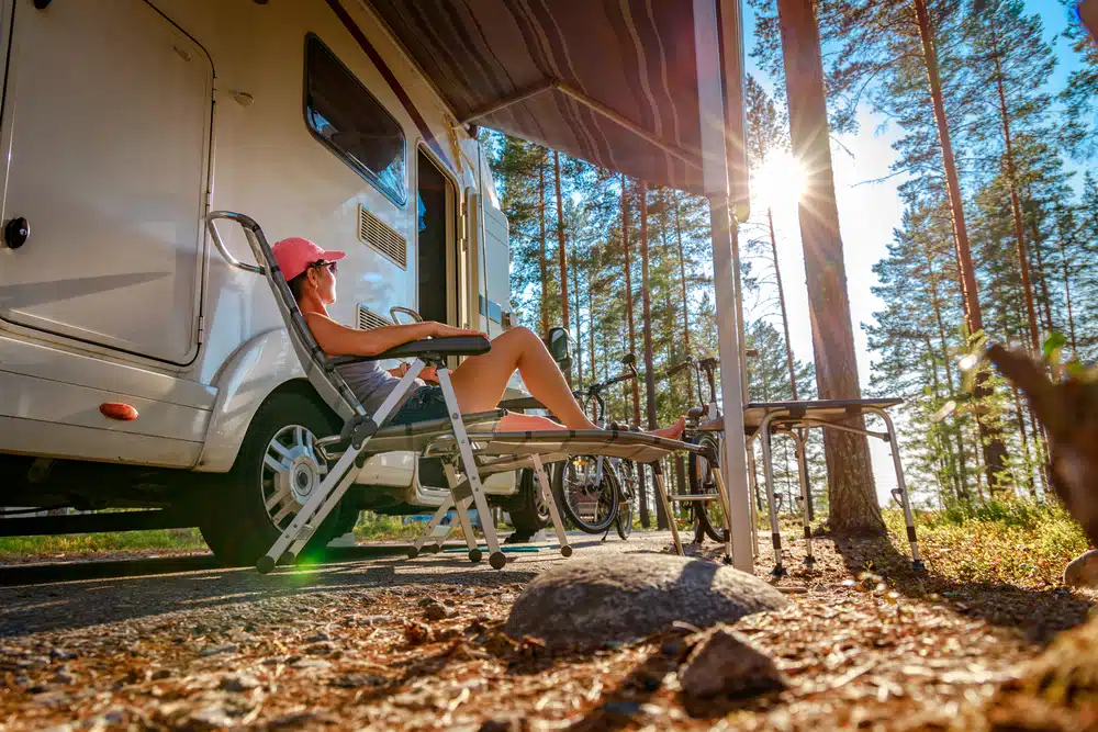 RV Site with person relaxing in chair