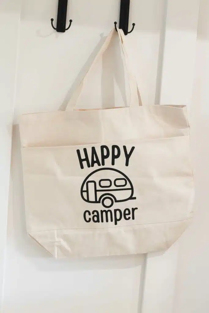 Happy Camper SVG hanging on wall hook
