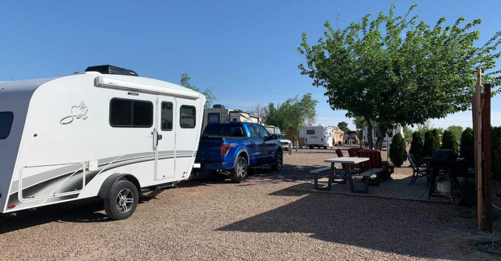 Travel Trailer and tow vehicle at campsite