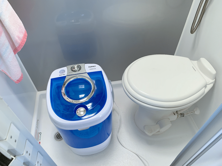 small portable washing machine in rv bathroom