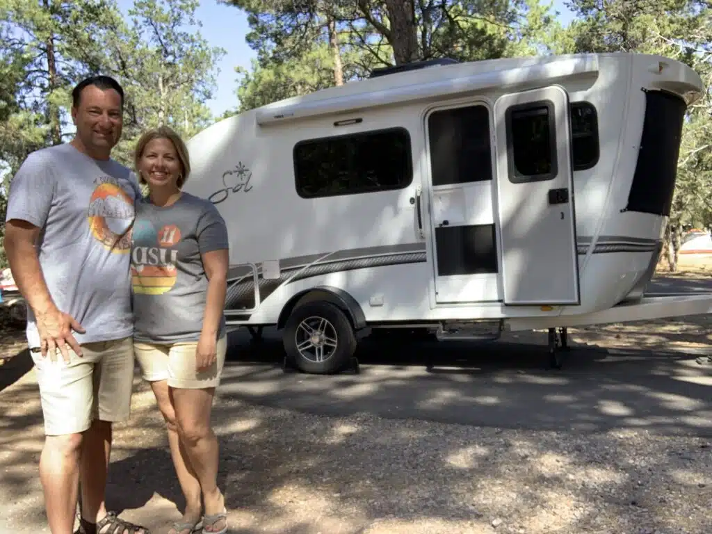 couple in front of intech sol horizon rv