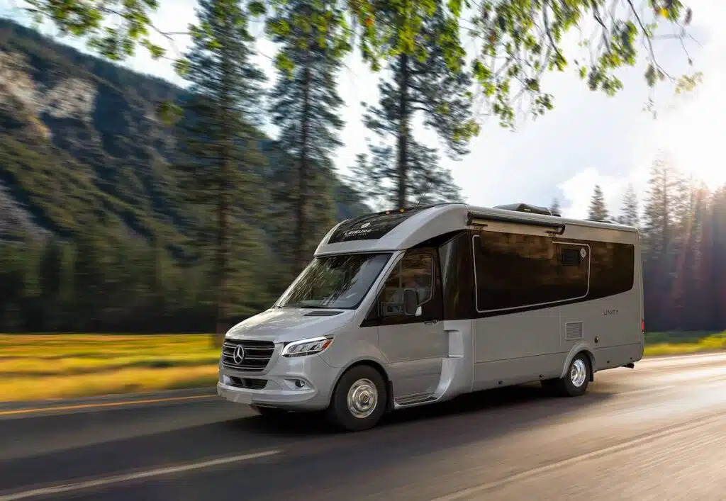 Leisure Travel Van Unity exterior with mountains and trees