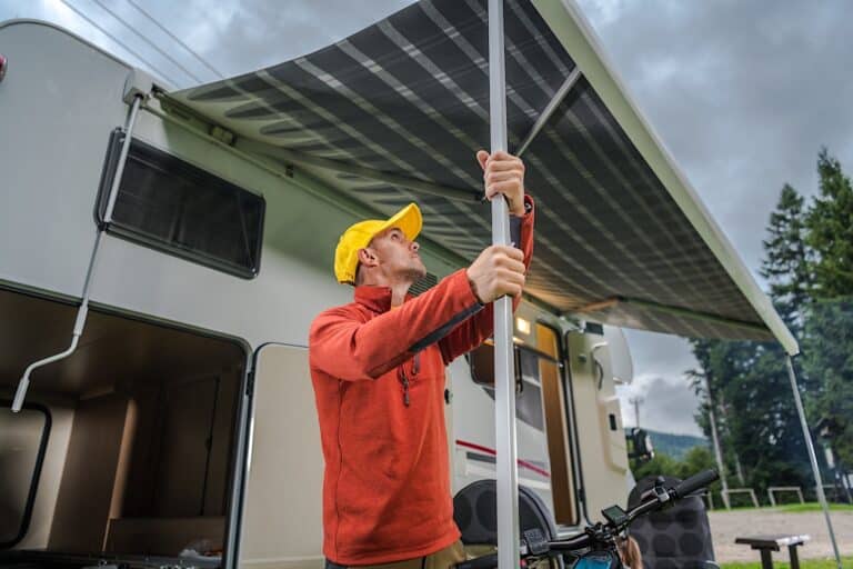 Man Extending RV Motorhome Awning