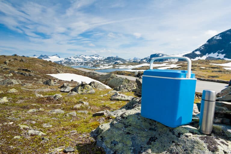 Camping Lunch Box and Thermos on Mountains