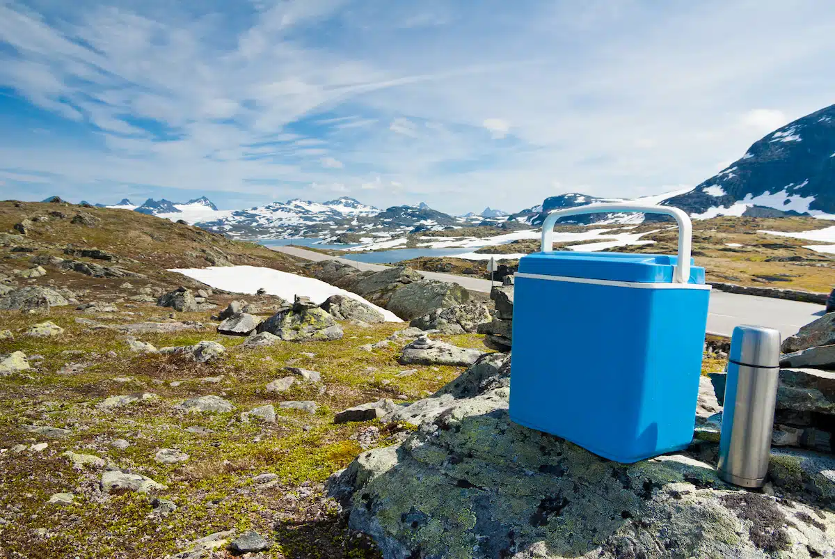Camping Lunch Box and Thermos on Mountains