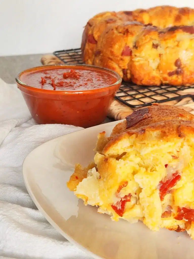 Piece of Pizza Bread on table with marinara sauce