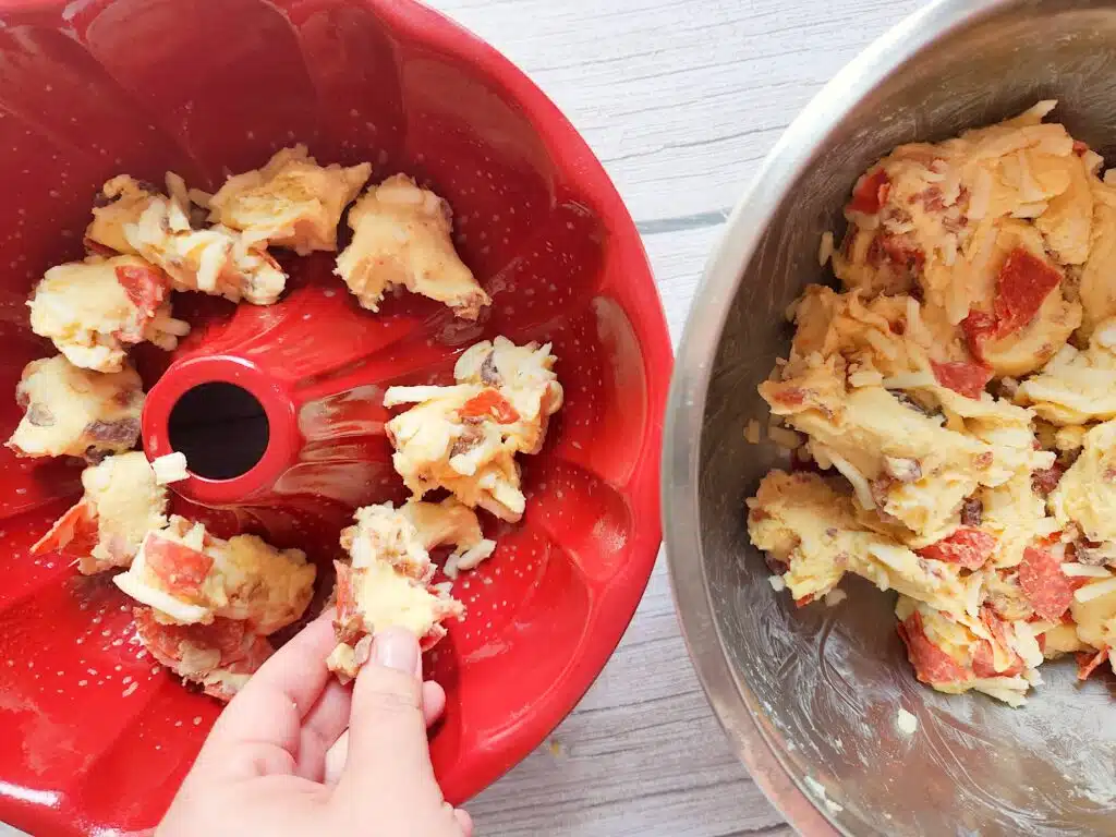 Pizza Bread Step 5 Add ingredients to bundt cake pan