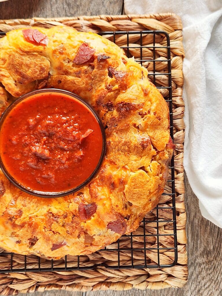 Pull Apart Pizza Bread with sauce on table
