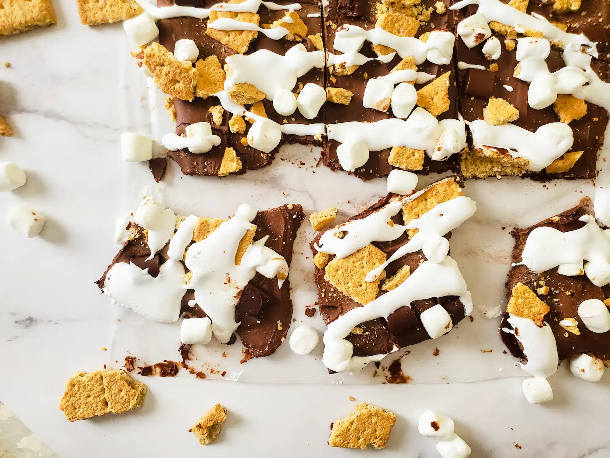 Close up of Smores Bark crumbled on marble table