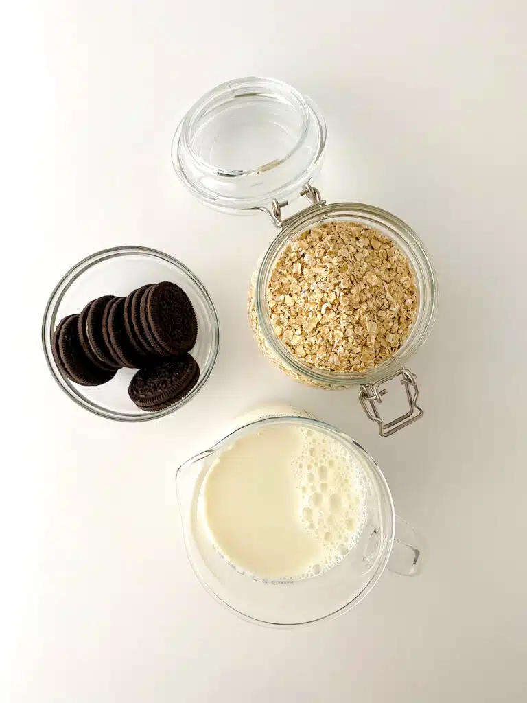 Cookies N Creme Overnight Oats Ingredients overhead on white background