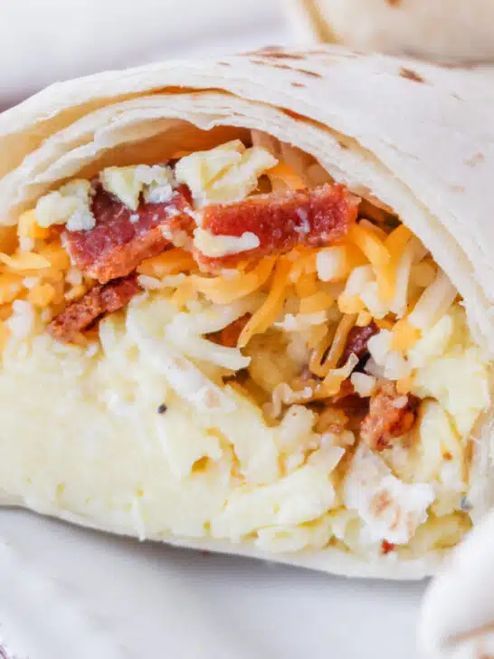 bacon, egg and cheese inside a wrapped tortilla