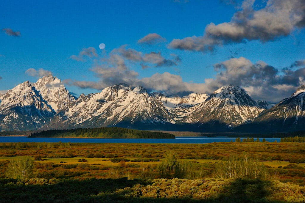 Grand Teton Mountains with bright blue sky and clouds