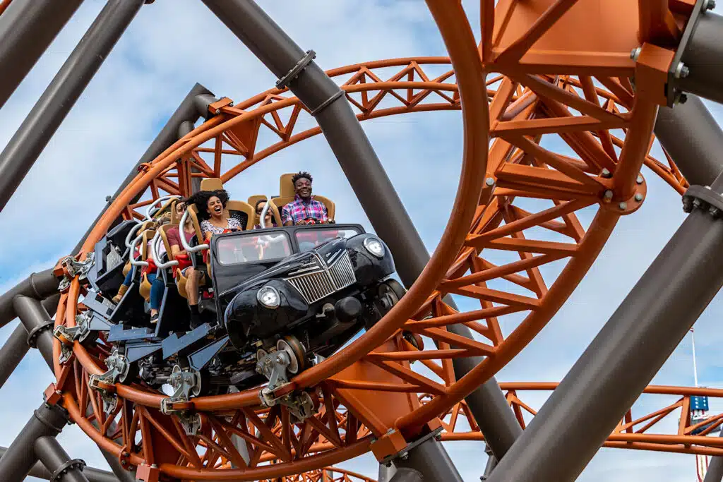 Guests onboard the Copperhead Strike roller coaster at Carowinds Amusement Park