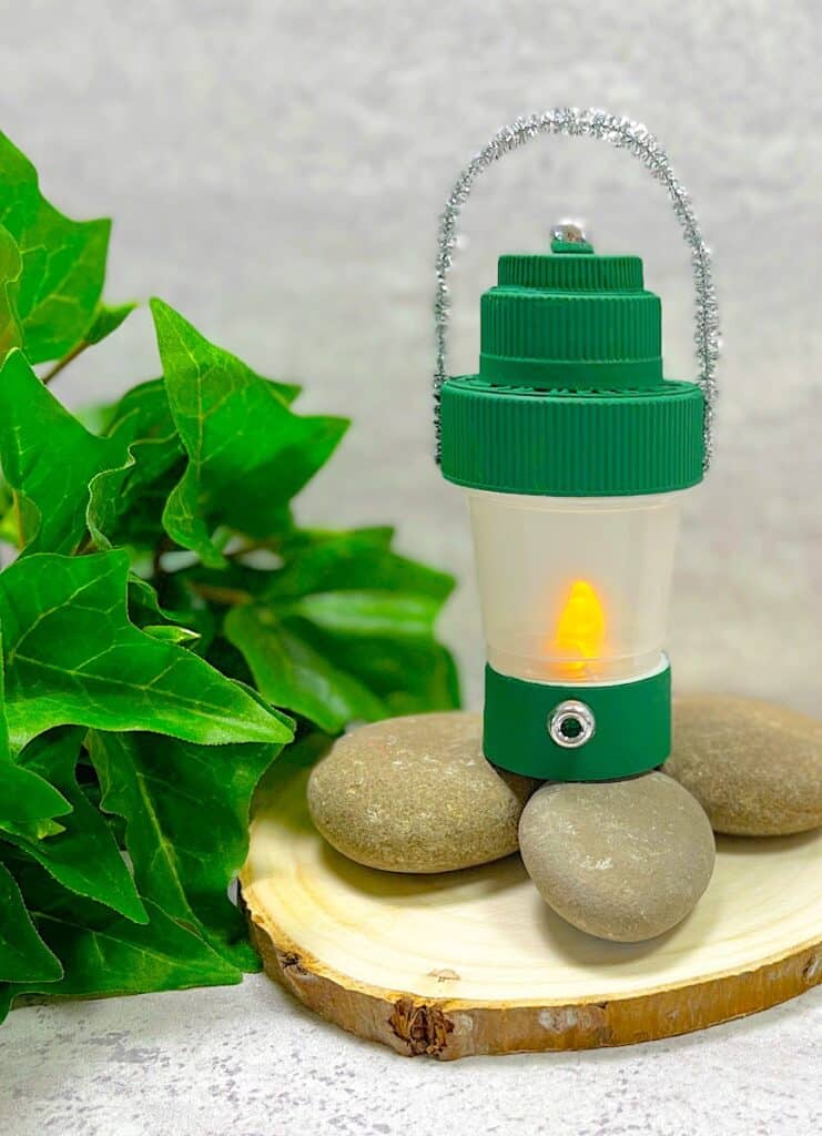 DIY Camping Lantern With Leaves on wood cutting and Rocks