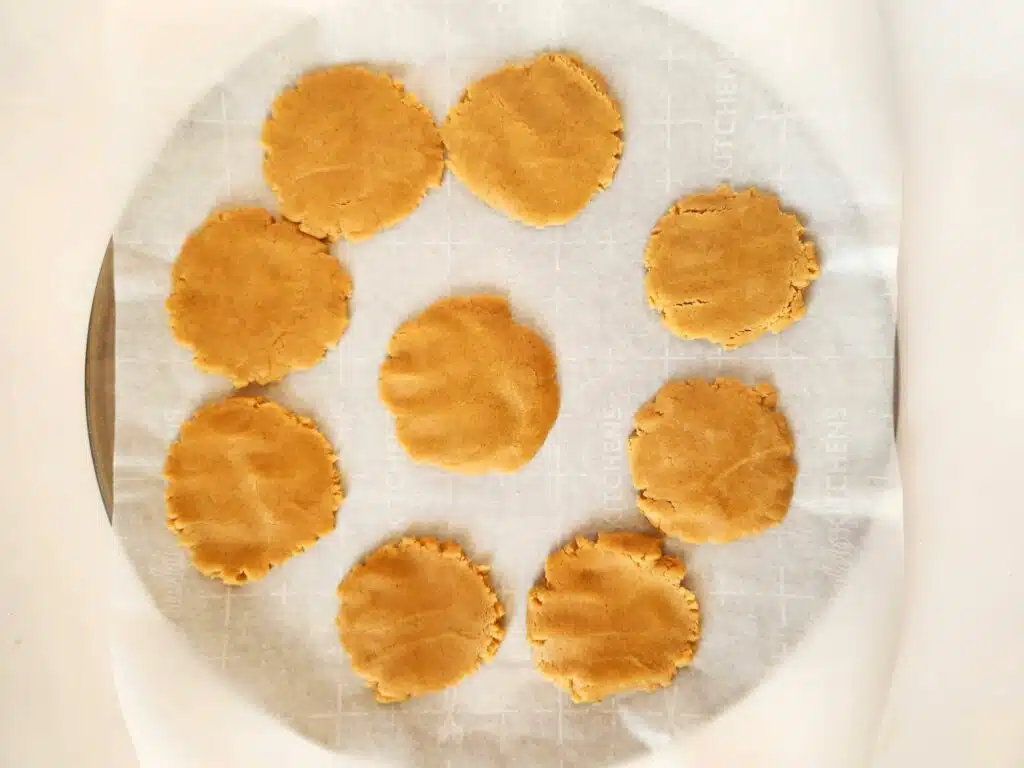 Peanut butter cookies on a baking sheet.