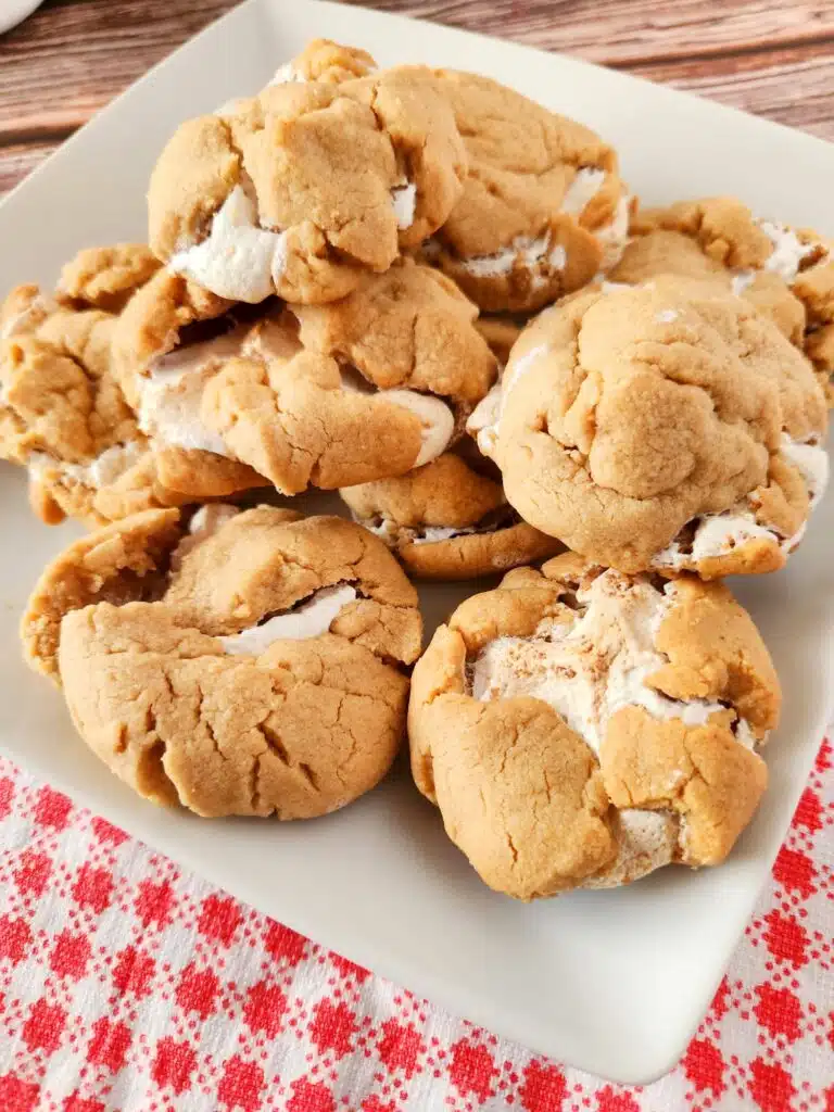 S'mores cookies on a plate with a red and white checkered napkin.