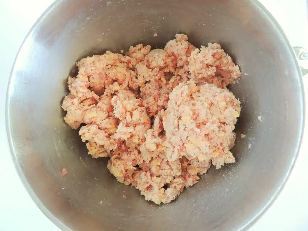 A bowl full of meat in a metal bowl.