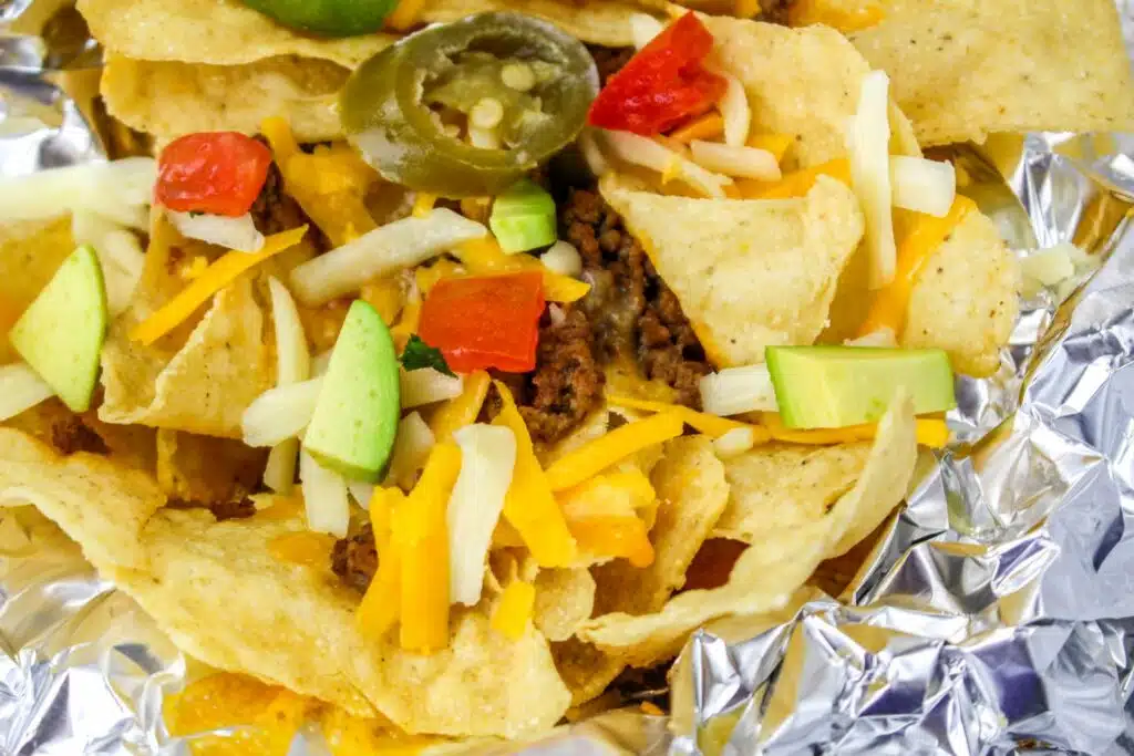 Nachos in foil on a white background.